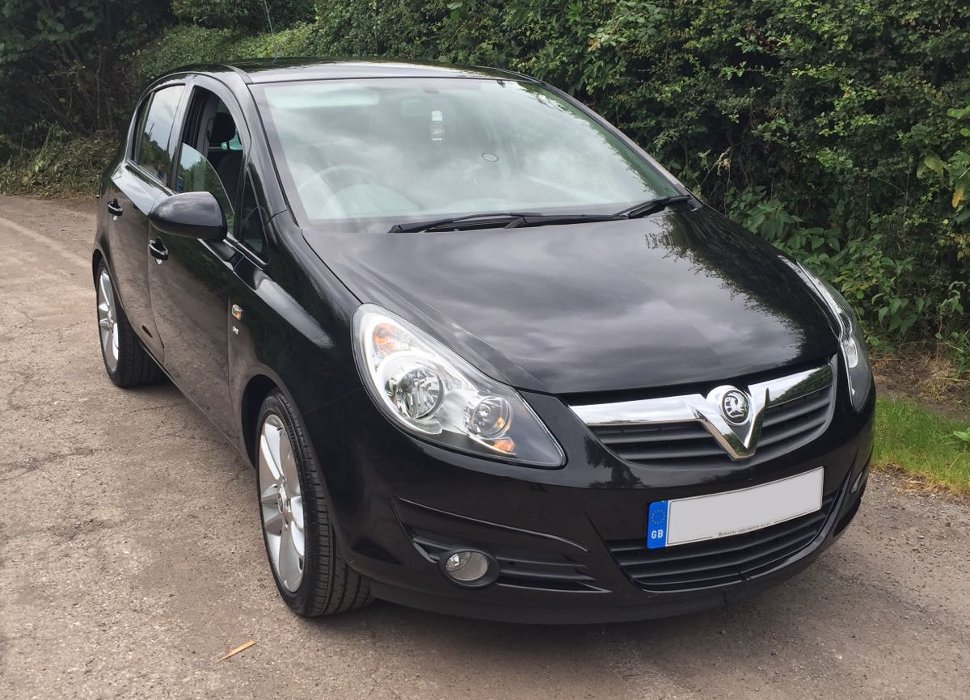 Milly and Katie with Mica, the Vauxhall Corsa SXI support car